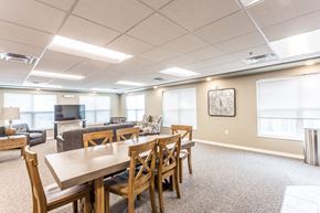Sioux Falls apartment for rent - a large dining room with wooden tables and chairs