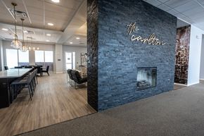 Sioux Falls apartment for rent - a dining room with a fireplace and a table and chairs