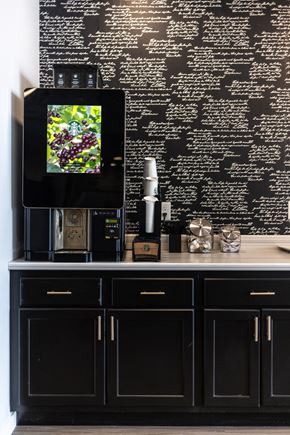Sioux Falls apartment for rent - a black kitchen with black cabinets and a tv on a black wall