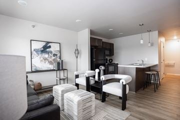 Sioux Falls apartment for rent - a living room and kitchen with a couch and a table
