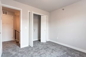 Sioux Falls apartment for rent - an empty bedroom with a closet and an open door