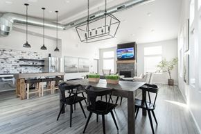 Sioux Falls apartment for rent - a large dining room with a wooden table and black chairs