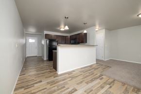 Sioux Falls apartment for rent - A kitchen with a white counter and wooden flooring.