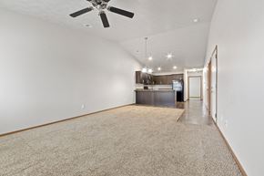 Harrisburg townhouse for rent - A spacious room with a ceiling fan and a carpeted floor.