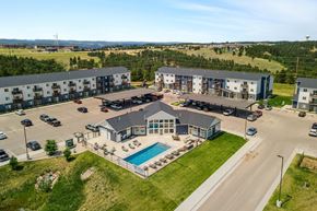 Rapid City apartment for rent - an aerial view of an apartment building with a swimming pool