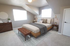 Sioux Falls apartment for rent - a bedroom with a bed and a dresser and a window