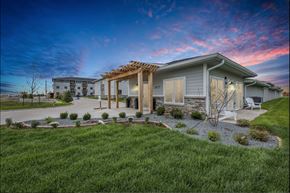 Johnston apartment for rent - a home with a covered porch and a grassy yard