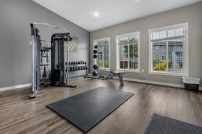 Sioux Falls townhouse for rent - A spacious home gym with a variety of equipment.