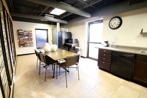 Sioux Falls apartment for rent - a dining room with a table and chairs and a clock on the wall