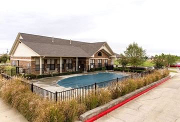 Searcy apartment for rent - a house with a swimming pool in front of a building
