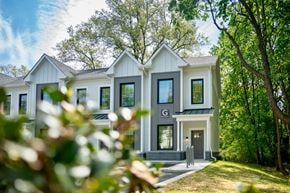 Madison apartment for rent - A white house with a grey front porch and a black door.