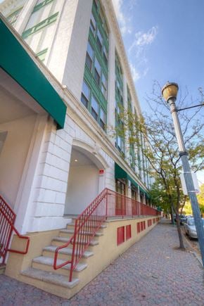 Keansburg apartment for rent - a building with red stairs and a street light