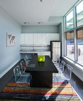 Community room with kitchen, flat screen tv and wifi workstations