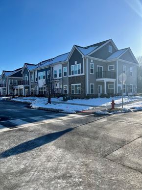 Hillsborough Township apartment for rent - an apartment building with a red fire hydrant in the snow