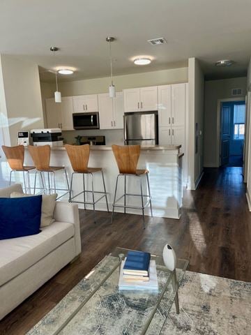 Hillsborough Township apartment for rent - an open living room and kitchen with a bar and a couch