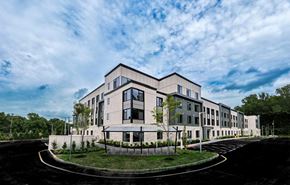 Princeton apartment for rent - A modern building with a curved driveway in front.