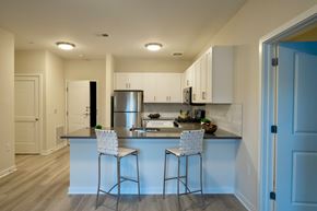 Princeton apartment for rent - A kitchen with a bar stool and a counter.