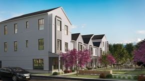 Madison apartment for rent - A modern two-story building with a black car parked in front.