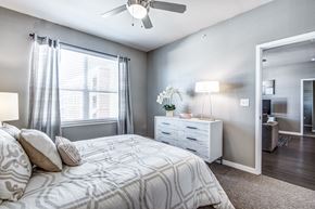 San Antonio apartment for rent - a bedroom with a bed and a ceiling fan at Republic at Alamo Heights, Texas, 78209