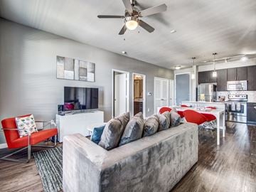 San Antonio apartment for rent - a living room with a couch and a ceiling fan