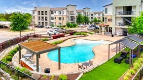 Austin apartment for rent - a swimming pool in front of an apartment building at Radius on Grove, Austin, 78741