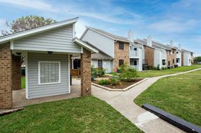 Austin apartment for rent - our apartments have a walkway to the street with grass at Northchase, Texas, 78753
