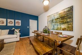 San Antonio apartment for rent - a dining room with a wooden table and bench and a couch in the background at Villa Espada Apartments, San Antonio, 78221