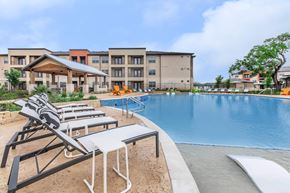 San Antonio apartment for rent - Resort style pool with covered pavilion and lounge seating at Sienna at Westover Hills Apartments, San Antonio, Texas