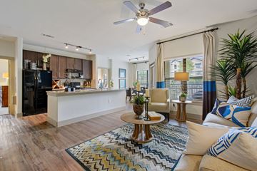 Round Rock apartment for rent - A living room with a white sofa and a coffee table.