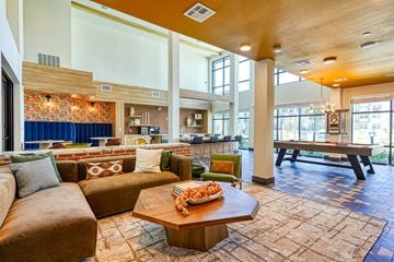 Austin apartment for rent - A living room with a brown couch and a coffee table.