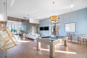 Austin apartment for rent - Clubhouse lounge with pool table and seating at Hangar at Bergstrom Apartments, Texas, 78744