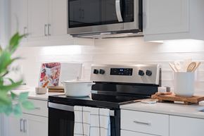 Austin apartment for rent - Modern kitchen with stainless steel appliances at Hangar at Bergstrom Apartments, Austin, TX