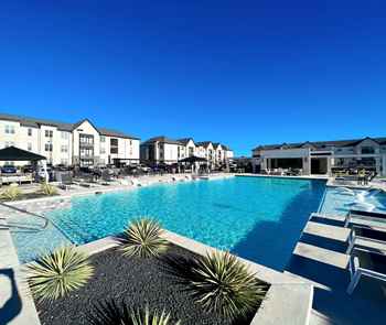 A large swimming pool in front of a building