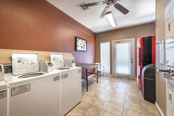 Community laundry room with washers and dryers