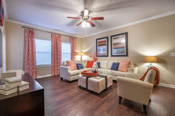Living room with sectional sofa and ceiling fan