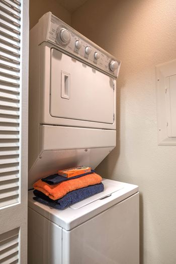 Stacked washer and dryer in laundry alcove
