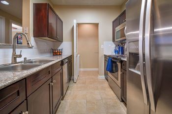 Galley kitchen with stainless steel appliances