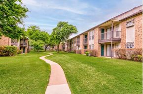 Garland apartment for rent - With winding walkway and mature trees at The Courtyard Apartments, Garland, TX