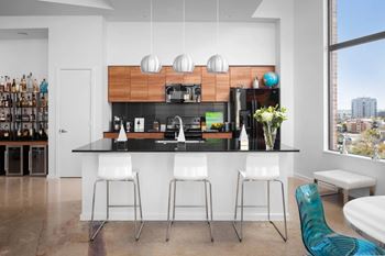 Kitchen island with bar seating and pendant lighting