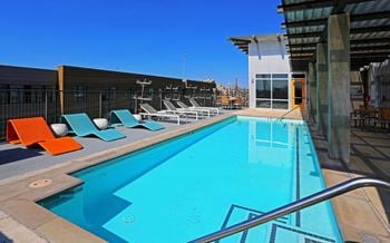 Rooftop pool with colorful lounge chairs