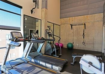 Fitness center with cardio equipment and training area