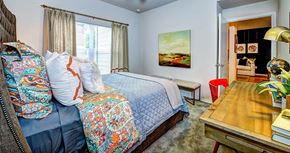 San Antonio apartment for rent - a bedroom with a bed and a desk at Villa Espada Apartments, San Antonio