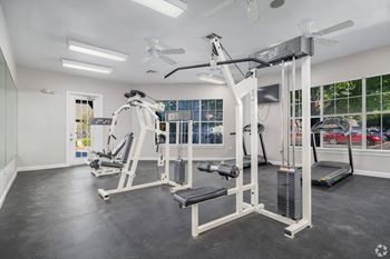 Fitness center with cable machines and treadmill