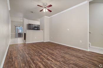 Living room with wood style flooring and ceiling fan