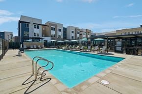 Roseville apartment for rent - Resort style swimming pool with lounge seating at The Crawford Apartments, California, 95747