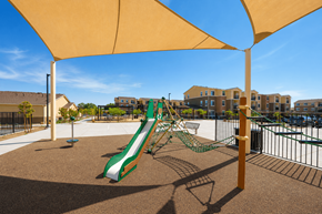 Lancaster apartment for rent - Playground with slide at Terracina at Lancaster | Affordable Apartments, Lancaster, CA, 93535