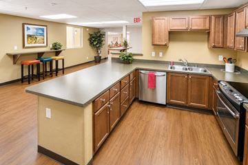 Huntington Park apartment for rent - A kitchen with wooden cabinets and a large island.