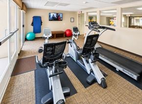 Huntington Park apartment for rent - A gym with treadmills and exercise balls.