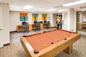 Huntington Park apartment for rent - A pool table in a room with a painting on the wall.