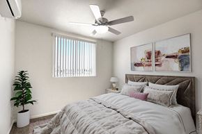 Panorama City apartment for rent - a virtually staged bedroom with a bed and a ceiling fan